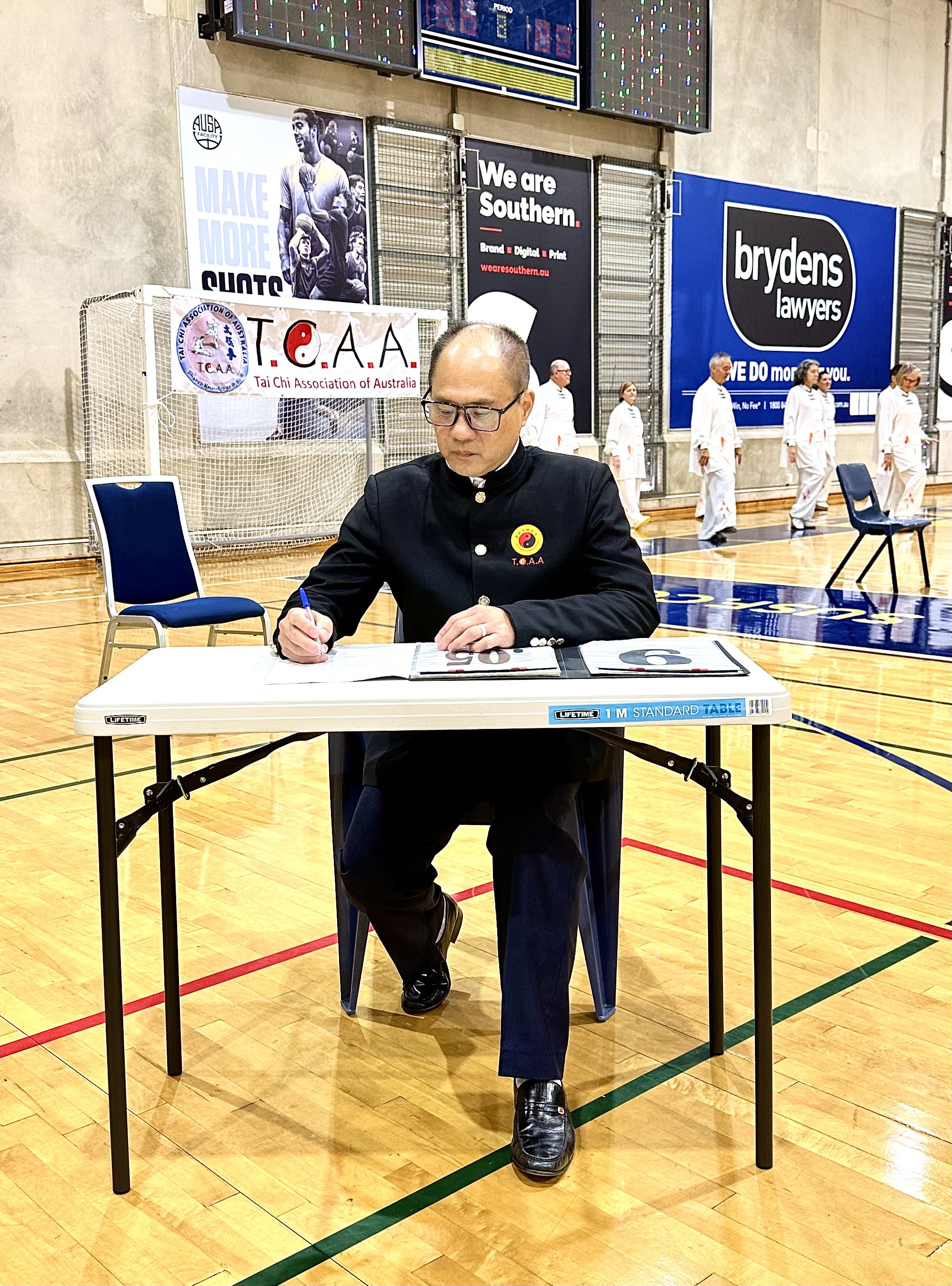 Master Stephen Lin serving as a competition referee